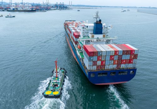stern of Cargo container Ship in the ocean sea concept logistic transportation export to customs forwarding logistics service. Container on Bulk ship